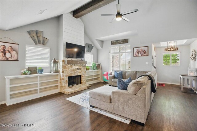 10309 Ave X, Lubbock, TX 79423 - living area with dark wood-style floors, beamed ceiling, ceiling fan, a chandelier, and a fireplace