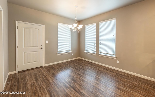 5234 Jarvis St, Lubbock, TX 79416 - spare room featuring a chandelier and dark wood finished floors