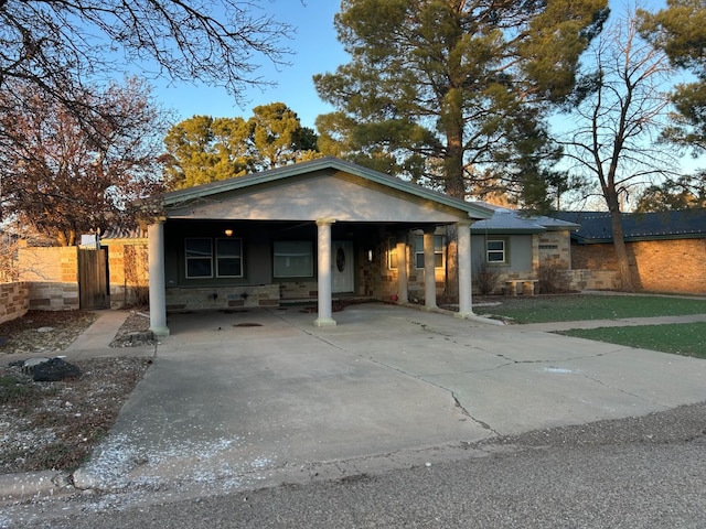 view of front of home with a carport