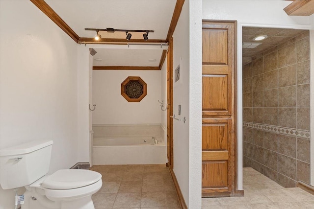 bathroom with ornamental molding, a tub to relax in, toilet, and tile patterned flooring