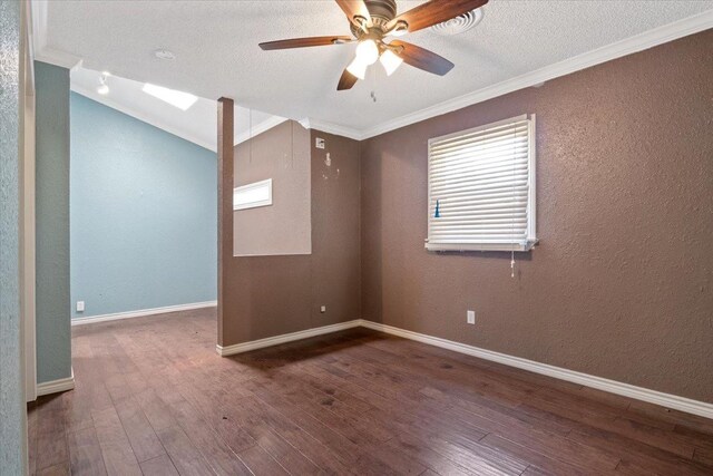 spare room with hardwood / wood-style floors, ornamental molding, and ceiling fan