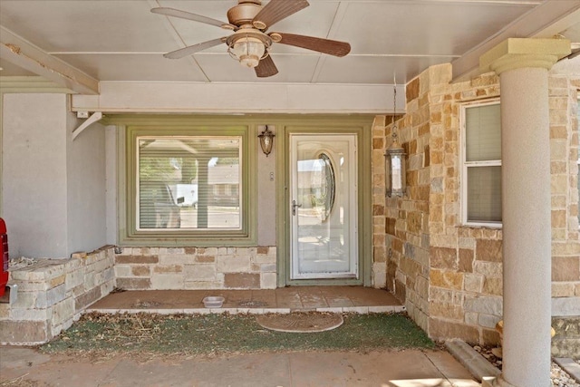 entrance to property featuring ceiling fan