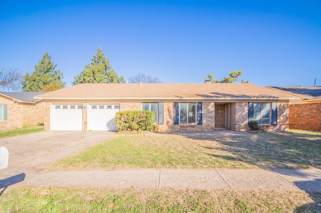 single story home with a garage and a front lawn