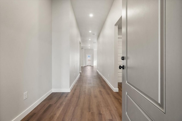 hallway with dark wood-type flooring