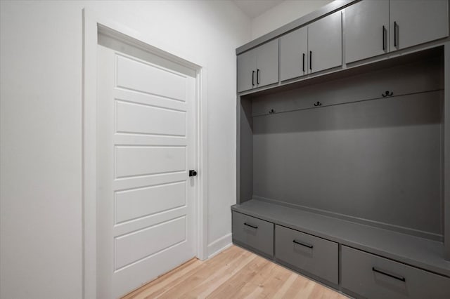 mudroom with light hardwood / wood-style floors