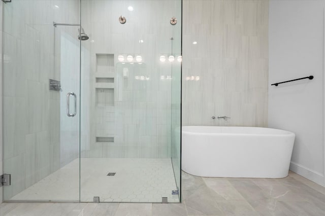 bathroom with separate shower and tub