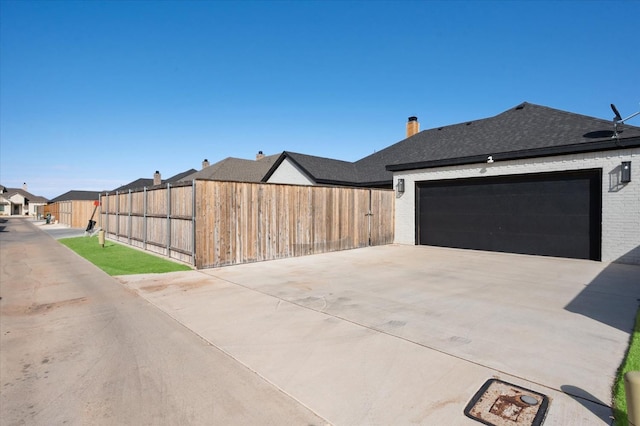 view of side of home with a garage