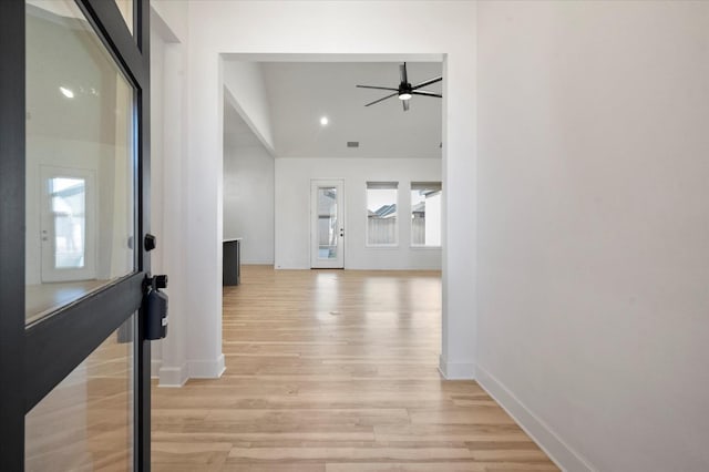 hall with light hardwood / wood-style floors