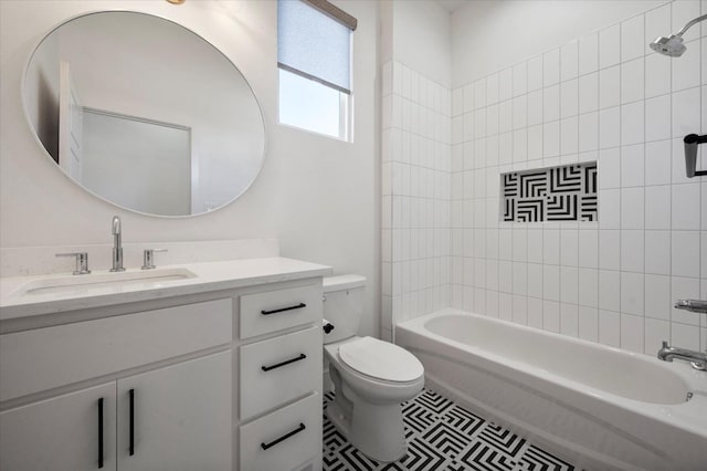 full bathroom featuring vanity, tiled shower / bath combo, tile patterned floors, and toilet