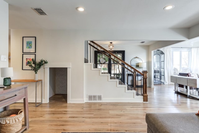 stairway featuring hardwood / wood-style floors