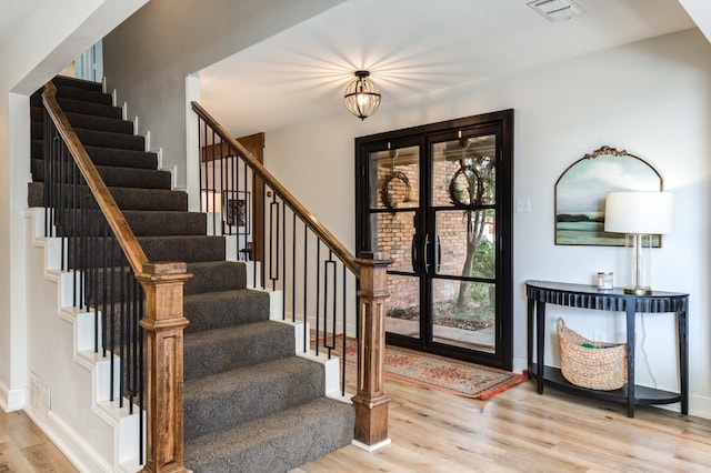 entrance foyer with light hardwood / wood-style flooring