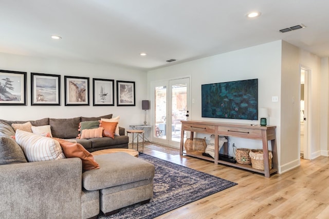 living room with light hardwood / wood-style floors