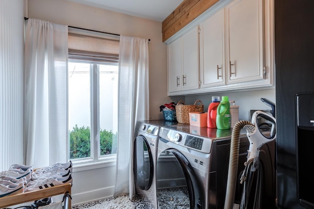 laundry area with cabinets, plenty of natural light, and washer and dryer