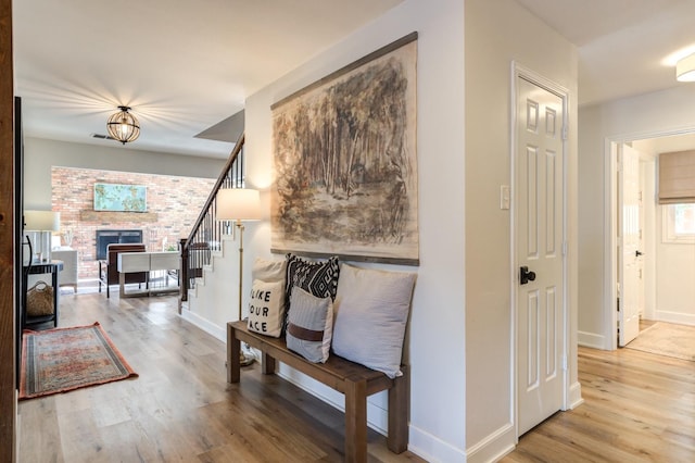 corridor with light hardwood / wood-style floors