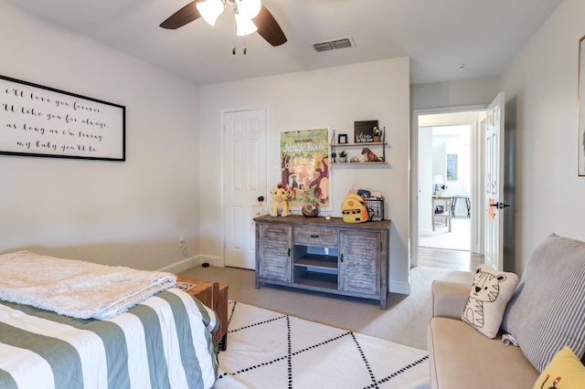 carpeted bedroom with ceiling fan