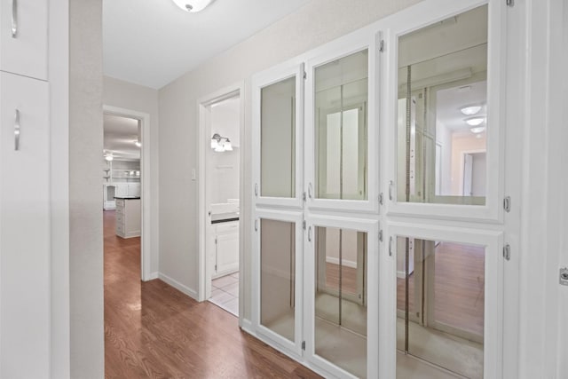 hallway with light wood-type flooring