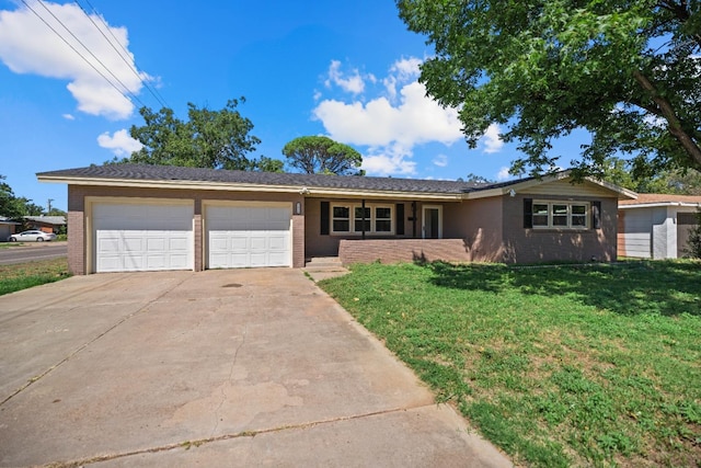 single story home featuring a garage and a front lawn