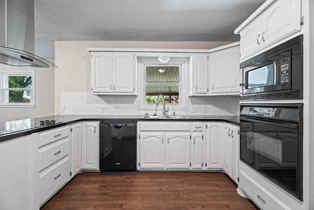 kitchen featuring ventilation hood, black appliances, and white cabinets