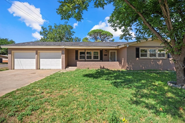 ranch-style house with a garage and a front lawn