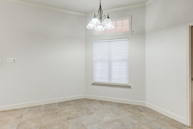 spare room featuring crown molding and an inviting chandelier