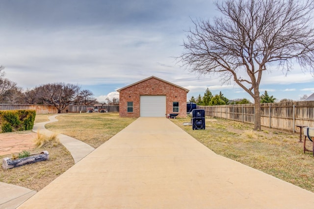 exterior space with a garage and a front yard