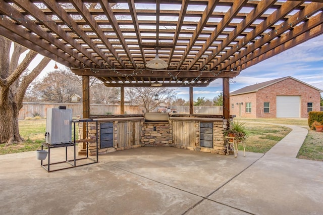 view of patio with a pergola and an outdoor kitchen