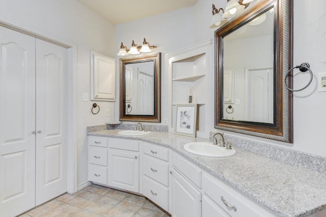 bathroom with tile patterned flooring and vanity