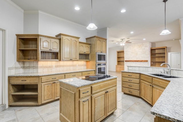 kitchen with sink, appliances with stainless steel finishes, hanging light fixtures, a center island, and tasteful backsplash