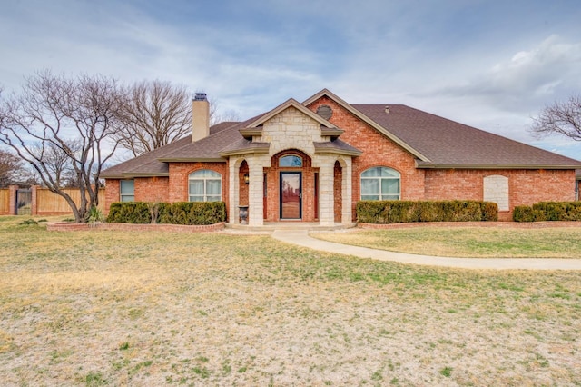 view of front of home with a front lawn