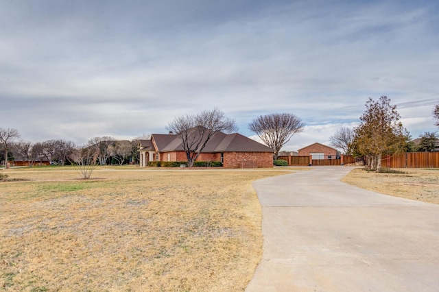 ranch-style home with a front yard