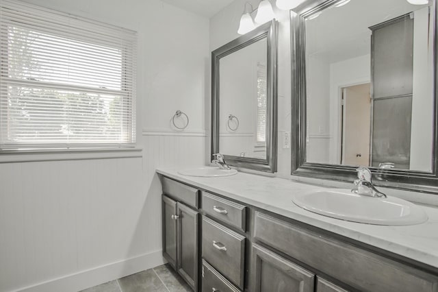 bathroom with tile patterned floors and vanity