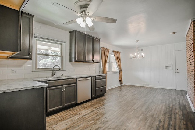 kitchen with dishwasher, dark brown cabinets, sink, and light wood-type flooring