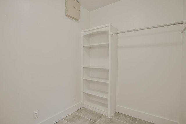 spacious closet featuring light tile patterned floors