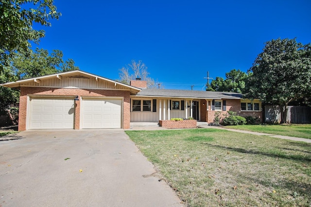 ranch-style house featuring a garage and a front yard