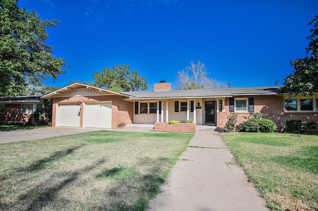 single story home with a garage, covered porch, and a front lawn