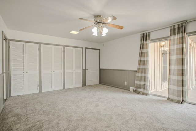 unfurnished bedroom with carpet floors and ceiling fan