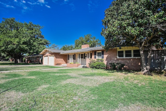 ranch-style house with a garage and a front lawn