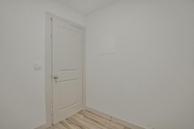 interior space with light wood-style flooring and baseboards