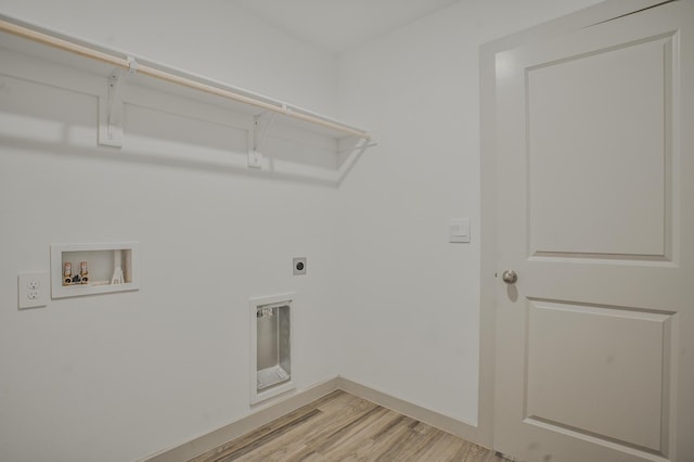laundry area with hookup for a washing machine, laundry area, electric dryer hookup, light wood finished floors, and baseboards