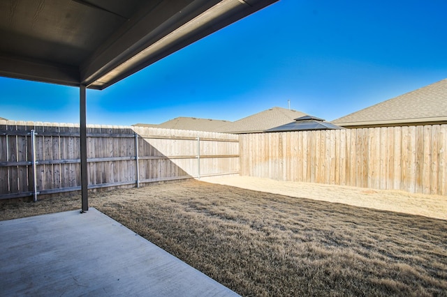 view of yard featuring a patio and a fenced backyard