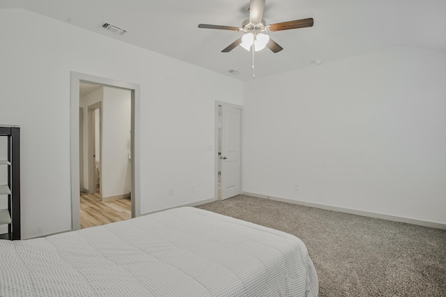 bedroom with baseboards, visible vents, a ceiling fan, and light colored carpet