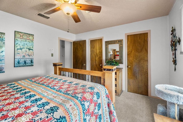 4405 56th St, Lubbock, TX 79414 - bedroom with a textured ceiling, carpet flooring, and ceiling fan