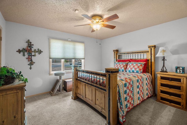 4405 56th St, Lubbock, TX 79414 - bedroom featuring light colored carpet, a textured ceiling, and a ceiling fan