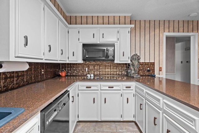 4405 56th St, Lubbock, TX 79414 - kitchen with black microwave, dishwasher, tasteful backsplash, and white cabinetry