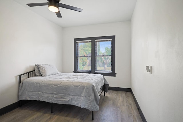 bedroom featuring hardwood / wood-style floors and ceiling fan