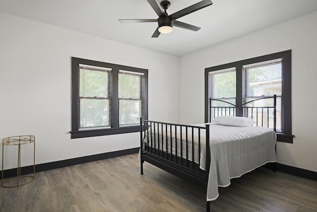 bedroom featuring hardwood / wood-style flooring and ceiling fan