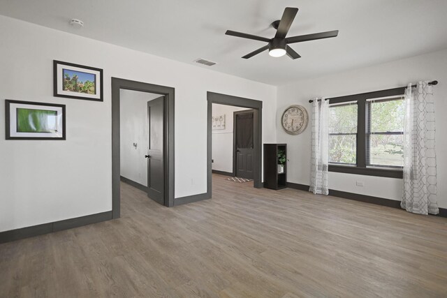 bedroom with dark wood-type flooring and ceiling fan