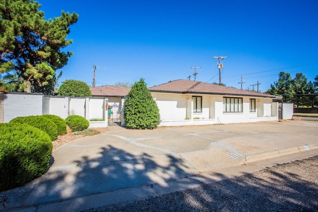 single story home with a garage