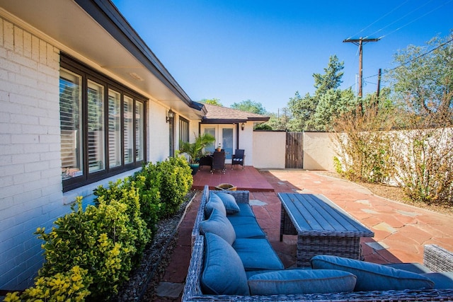 view of patio featuring french doors and outdoor lounge area