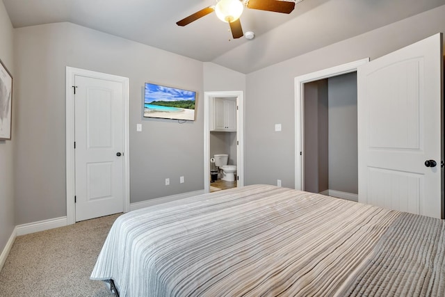 carpeted bedroom with lofted ceiling, connected bathroom, and ceiling fan